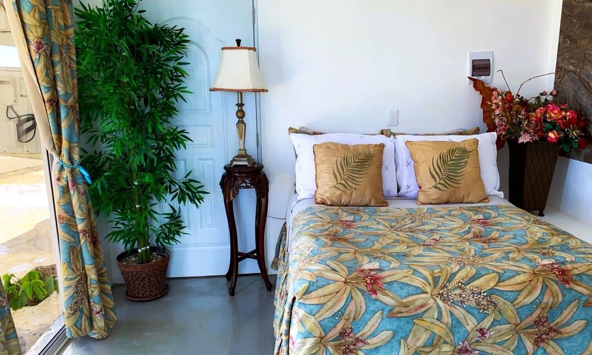 Cabrera Hotel | Adorable tropical room with a stunning balcony, pool, fire pit, gardens, & more!