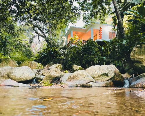 Jarabacoa House | Casa del Arroyo 2-Bedroom Cottage Fireplace and BBQ