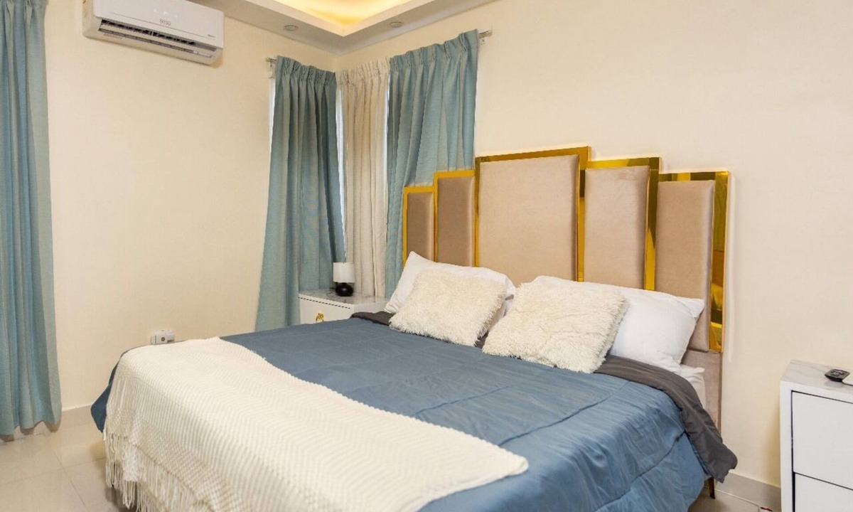 Prado Oriental House | Charming 2-bedroom building in Tranquil Santo Domingo Este with AC