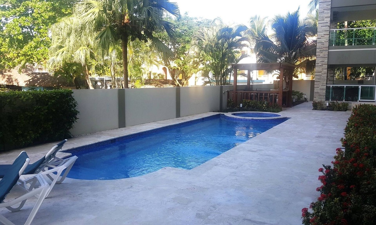 El Batey Apartment | Groundfloor 2BD 2BTH condo, guest-friendly, pool, near sandy beach/shops