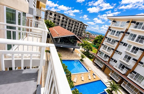 Mactan Export Processing Zone Condo | 2 Minutes from Mactan Airport | Free Pool, Gym, Wi-Fi, Netflix & Balcony View