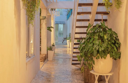 Zona Colonial Apartment | Anacaona Studio with ensuite bath, fully equipped kitchenette, and garden views.