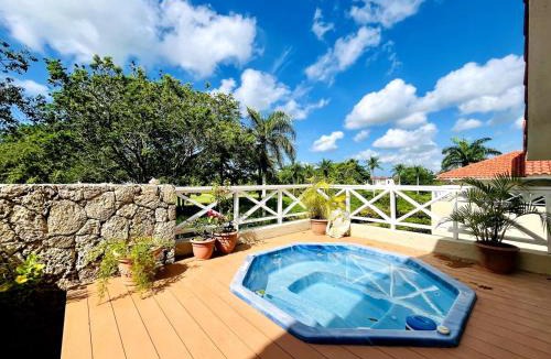Guayacanes Apartment | Elegant Golf Retreat with Jacuzzi Terrace - 3BR Apartment in Guavaberry Golf and Country Club - Gated Resort