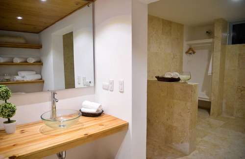 Villas Ana Maria Hotel | Guest-friendly Luxury hotel room in central Sosua, with private bar