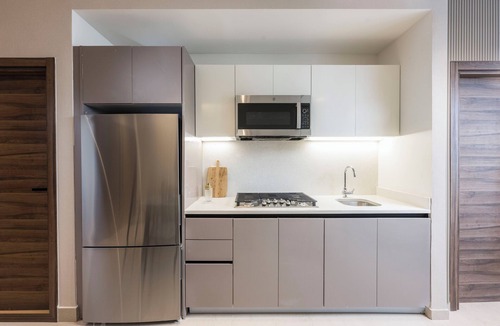 Yolanda Morales Apartment | Homeclub 1BR Residence BlueMall Rooftop Pool & Gym