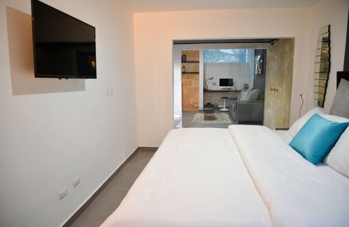 Villas Ana Maria Hotel | Luxury guest-friendly room in central Sosua, private bar, adults only