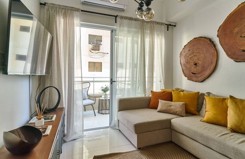 Yolanda Morales Condo | Modern King Size Bed Condo with Pool by Agora Mall