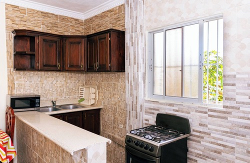 Corales del Sur Apartment | Modern Studio Near Airport Fast WiFi Generator