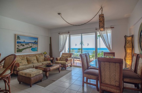Juan Dolio Apartment | Trendy Beach Scene at a Harmony Beachfront Condo in Costa del Sol