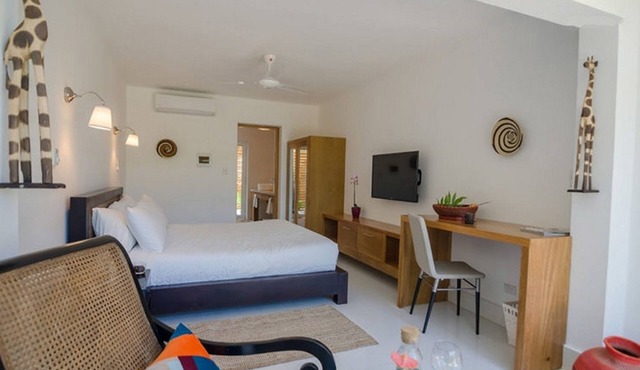 Bedroom in beachfront resort, Dominican meals available