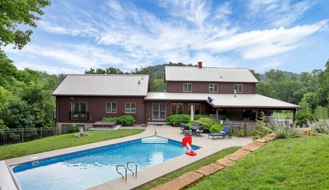 Hillside haven on expansive grounds, heated pool, firepit, bocce court and more! in Logan