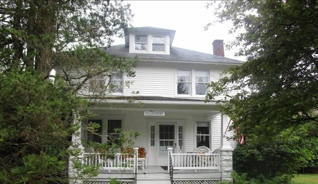Relax on the covered front porch at "Allegheny" in Eagles Mere in Eagles Mere
