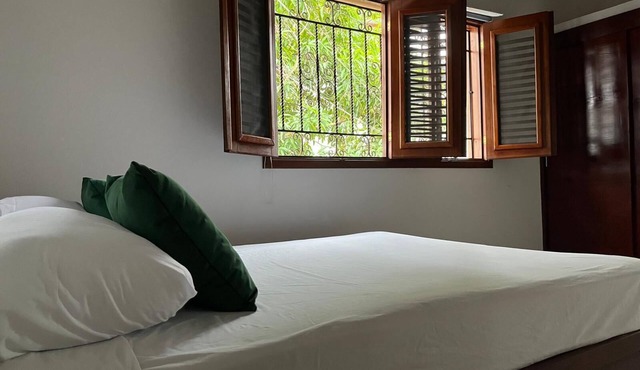 Traditional 2BR Dominican Home with Private Balcony - 10 Min Walk to Beach