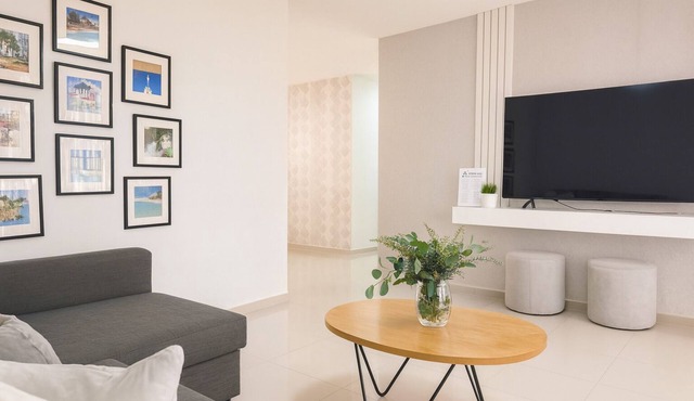 Unwind in this modern 3-bedroom apartment just 7 minutes from STI Airport and El Monumento. Sleeps up to 10 guests, features a fully equipped kitchen, A/C in every room, smart TV, washer/dryer, and Wi-Fi. Enjoy resort-style amenities including a gym,