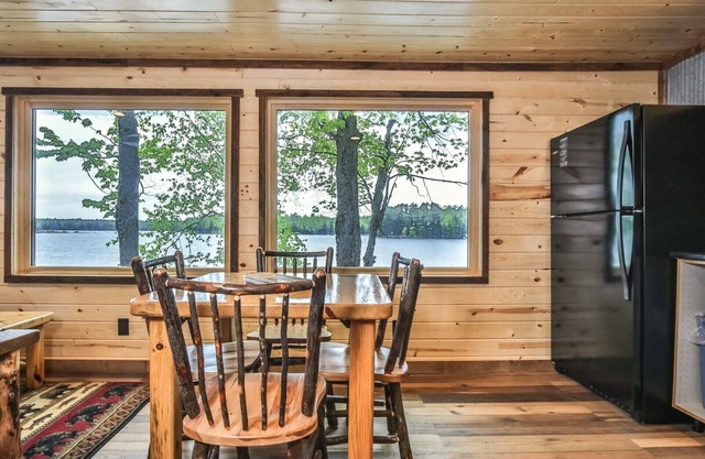 Remodeled lakeside resort cabin with fireplace, sandy beach, dock, firepit! in St. Germain