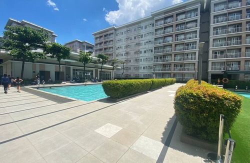 Novaliches Condo | Spacious Comfort: Two bedrooms & large living space ideal for families friends